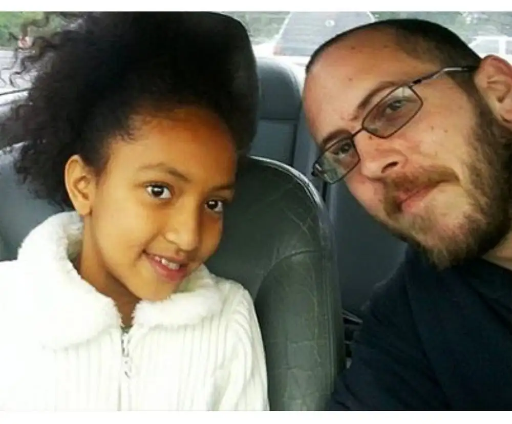 Joshua Lee Burgess with his daughter Zaria - image from blacknews.com